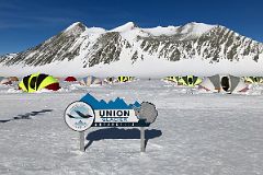 02A ALE Union Glacier Antarctica Sign And Very Comfortable Clam Tents With Mount Rossmann Beyond